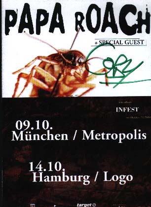 Coby Dick, singer of Papa Roach, autographs a flyer from their European tour