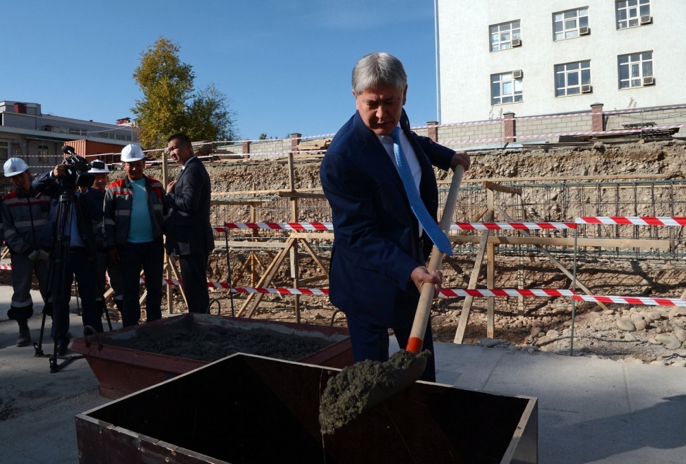President Almazbek Atambayev of Kyrgyzstan breaks ground on a new medical facility.