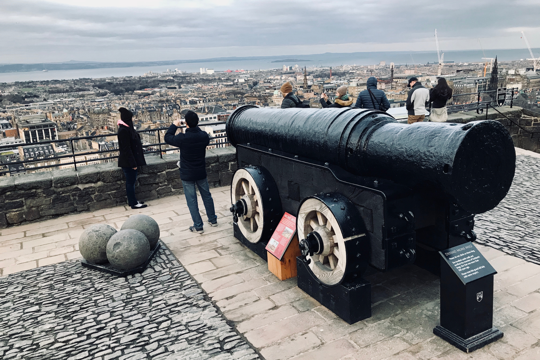 Mons Meg pointed out to the harbor below Edinburgh Castle