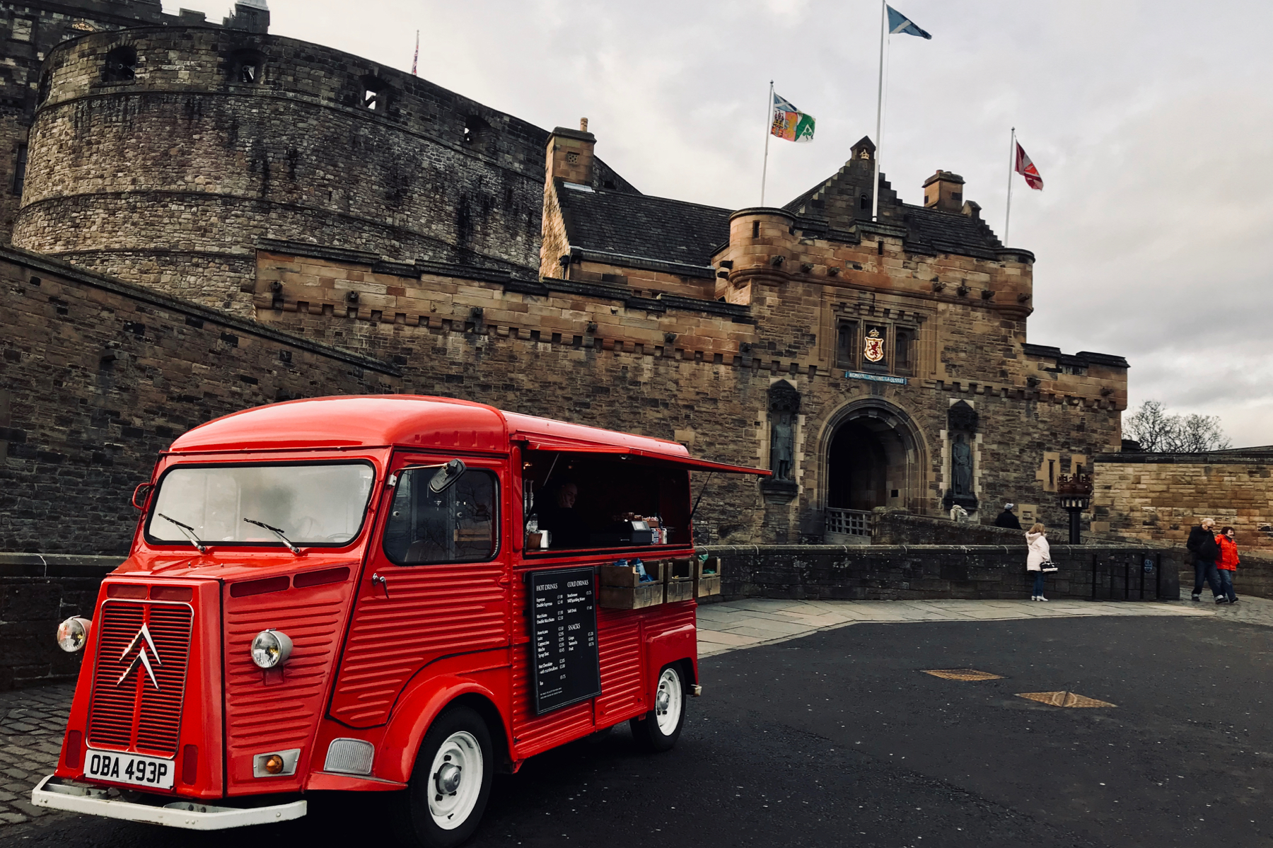 A red coffee truck stands in front of The Gatehouse at Edinburgh Castle