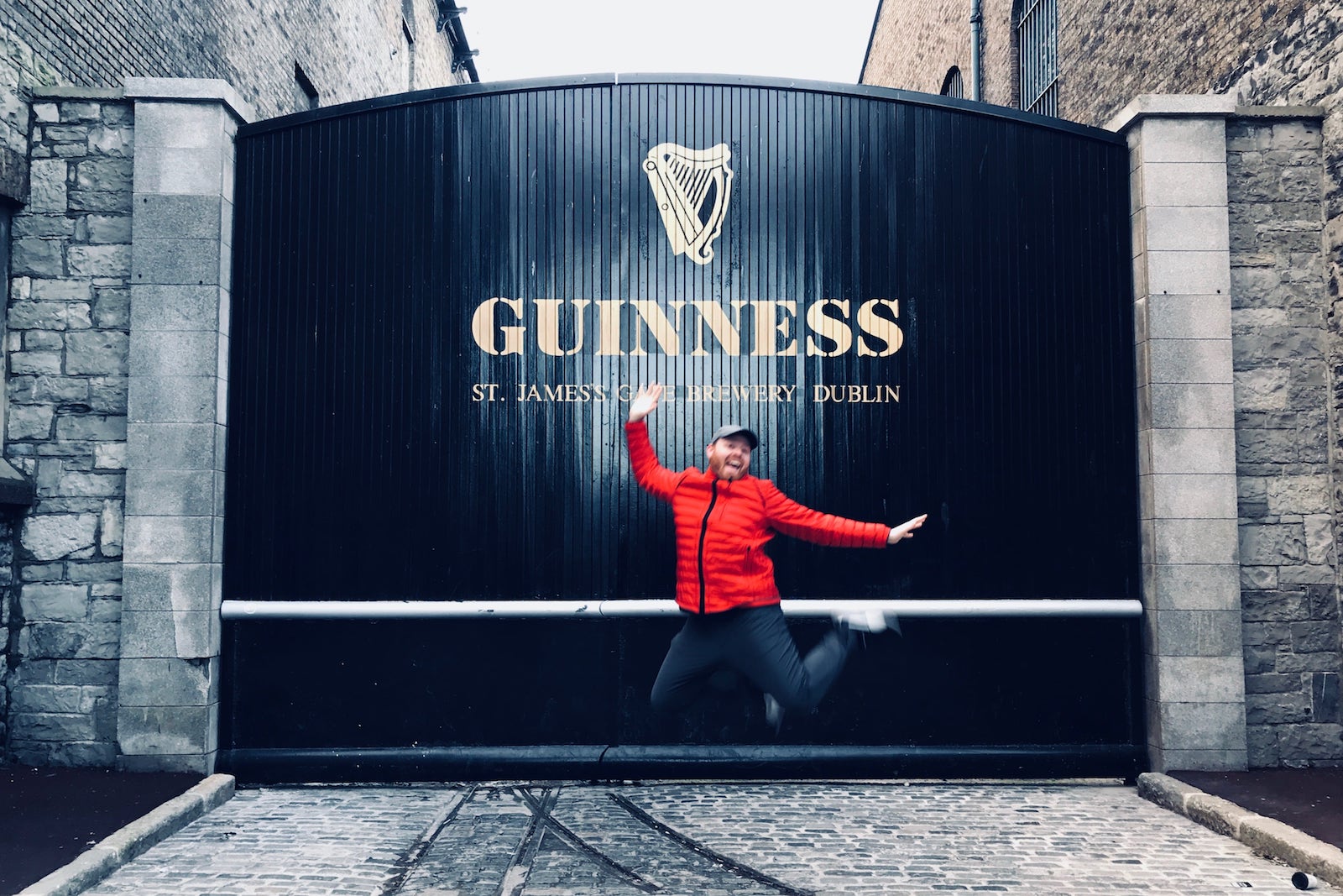 Judson jumps in the air in front of the Guinness Storehouse