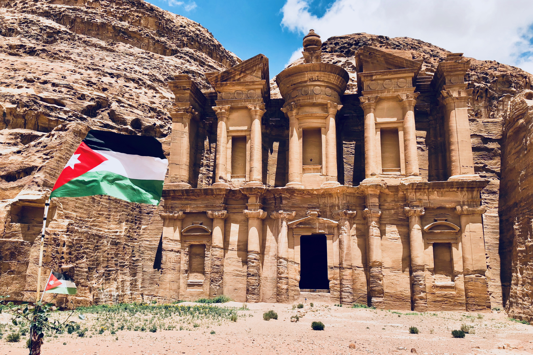 The Monastery at Petra with a Jordanian flag