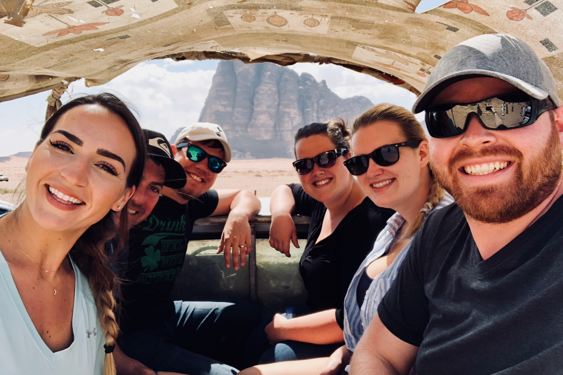 My new friends from the Wadi Rum tour, including Tiffany Tchouboukjian (opposite from me), pilled up in the back of a truck for our desert jeep tour